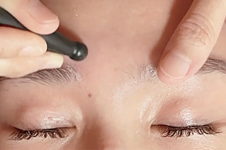 Bojin facial treatment to support circulation and facial tension relief at Adonis Skincare